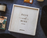 Wooden keepsake box with engraving on a dark background