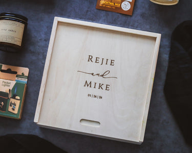Wooden keepsake box with engraving on a dark background