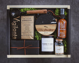 Gift set with coffee products and decorative items on a dark background