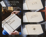 Wooden gift box with engraved names and monograms, featuring branding text.
