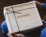 Personalized wooden box held by a person