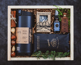 Gift set withBruTrek tumbler, Rock Creek Soaps product, and other items in a wooden box.